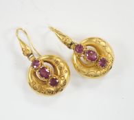 A pair of Victorian yellow metal canetile work and three stone garnet set drop earrings, overall