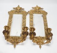 A pair of period-style mirrored brass girandoles, 61cm high