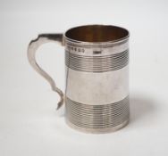 A George III reeded silver christening mug, Stephen Adam I, London, 1801, 85mm.