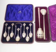 A cased pair of Victorian aesthetic period silver salad servers, Atkin Brothers, Sheffield, 1881 and
