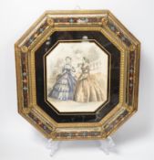 An octagonal embossed brass and verre eglomise mirrored frame,36cm x 39cm