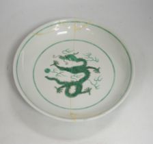 A Chinese green enamelled porcelain ‘dragon’ dish, 24cm in diameter (a.f.)