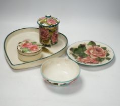 Wemyss ware - a roses preserve jar, three other items and an unusual ‘hair tongs’ heart shaped dish,
