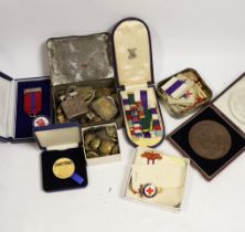 A quantity of medallions, badges etc including some military interest