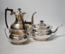 A George V silver coffee pot, teapot and sugar bowl, Fordham & Fordham, Sheffield, 1923. gross