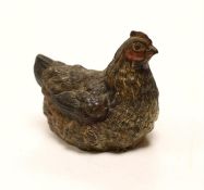 A large Austrian cold painted bronze model of a hen sitting, 5cm high