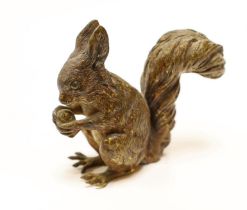 A large Austrian cold painted bronze of a squirrel eating a nut, 8cm high