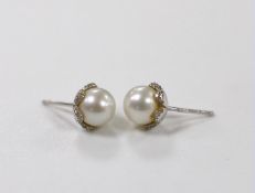 A pair of 18ct white gold, cultured pearl and diamond chip set ear studs, pearl diameter 8.15mm,