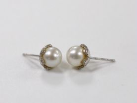 A pair of 18ct white gold, cultured pearl and diamond chip set ear studs, pearl diameter 8.15mm,