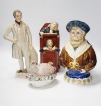 A Staffordshire figure of Wellington, a majolica sailor jug and a Vicar and Moses group, largest