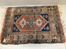 A Caucasian blue ground rug, 150 x 106cm