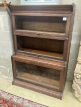 A Globe Wernicke style oak three section bookcase, width 87cm, depth 44cm, height 130cm