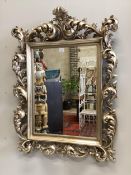 A Florentine style silvered composition wall mirror, width 90cm, height 120cm