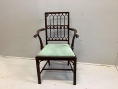 An Edwardian Gothic Revival mahogany elbow chair, width 58cm, depth 42cm, height 95cm
