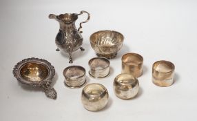 Sundry silver including six silver napkin rings, an 800 standard tea strainer and a white metal bowl