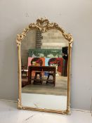 A 19th century carved wood and composition overmantel mirror, re-painted, width 104cm, height 173cm
