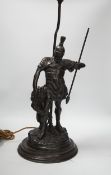 A bronze Roman soldier and lion table lamp, 60cm high including light fitting