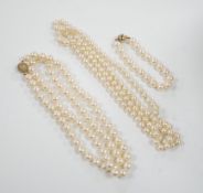 A single strand cultured pearl necklace, with diamond chip set 18ct gold clasp, 74cm and similar