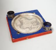A Chinese white metal ‘dragon’ salver, late 19th century, 20.2cm carded silk box base and two
