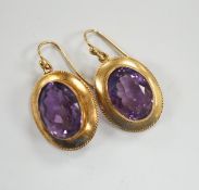 A pair of Victorian yellow metal and amethyst set oval drop earrings, 21mm, gross weight 6.3 grams.