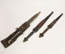 A Swedish Mauser bayonet and two North African daggers