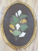 An oval framed cross stitch embroidery of a lily, indistinctly signed and dated, 80cm x 54cm