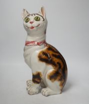 A Gallé faience cat ‘La Signara Colombina’ with glass eyes, signed Gallé Nancy to hind right foot,