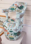 A Chinese famille verte porcelain ‘fish pond’ garden seat, 65cm high