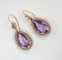 A pair of Victorian yellow metal, amethyst and seed pearl set teardrop shaped drop earrings, 21mm,
