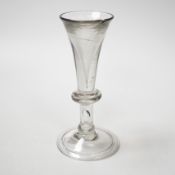 An English lead crystal baluster toastmaster’s glass, c.1710-20, elongated trumpet deceptive bowl on