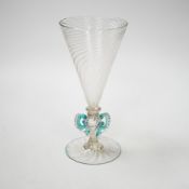 A Facon de Venise wine glass, c.1800, the round funnel bowl is spiral moulded over a blade knop,