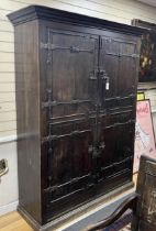 A pair of 16th century German or Netherlandish oak and wrought iron strapwork window shutters, later