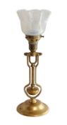 An early 20th century Scottish brass ship's gimballed desk lamp with vaseline glass shade, by