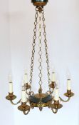 An early 20th century French brass and green lacquered six light chandelier, in the Empire style,