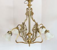 An Arts & Crafts brass four light electrolier, with vaseline glass shades, drop 80cm, width 84cm***