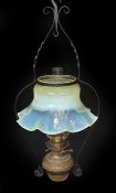 An English Arts & Crafts wrought iron and brass hanging oil lamp with Messengers mechanism and