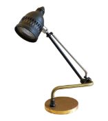 An early 20th century English brass, nickel and ebonised steel dentist's lamp, of adjustable form,