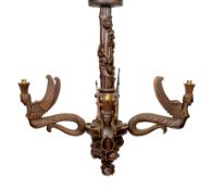 A Swiss Black Forest carved wood four light chandelier with caryatid branches and rose entwined