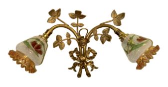 A set of three 1930's French cast brass wall lights modelled with ribbon tied roses, with