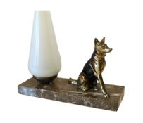 A mid 20th century bronzed metal and marble table lamp modelled with a seated Alsatian, with