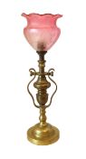 A 1920’s English brass gimbal lamp with etched pink tinted glass shade, height to top of shade