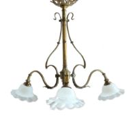 An early 20th century French gilt brass light fitting with frosted glass shades, width 78cm,