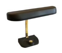 A mid century German lacquered and ebonised brass desk lamp with loaded base incorporating a
