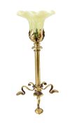 An early 20th century English Arts & Crafts brass table lamp with associated vaseline glass shade,