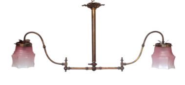 A Victorian brass gasolier light fitting with twin adjustable arms and pink tinted frosted glass