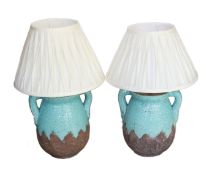 A pair of contemporary lava glazed ceramic table lamps, each with elaborate pleated shades, widest