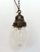 A 1920's English cut glass crystal acorn pendant complimented with gallery, chain, ceiling rose with