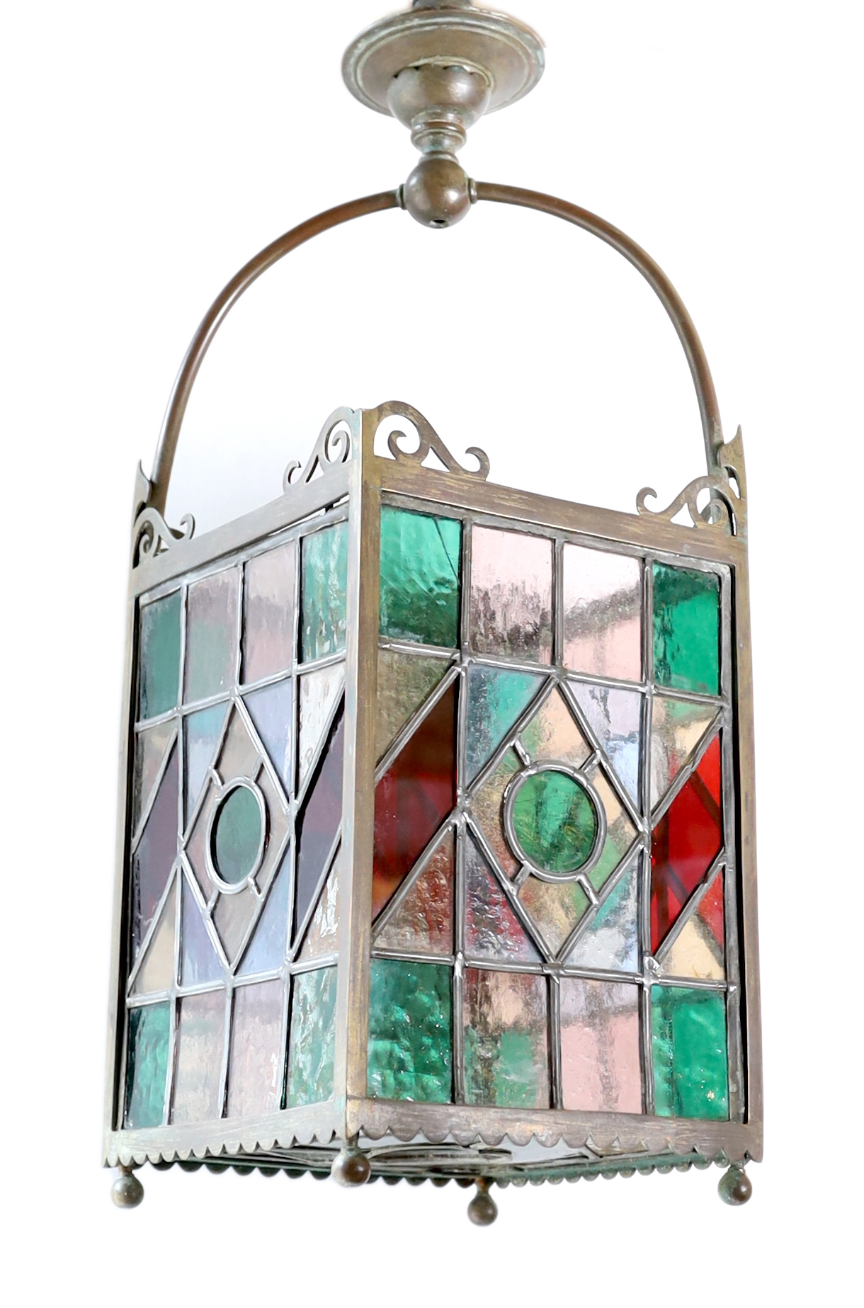 An English bronze hall lantern with leaded stained glass panels, width 20cm, height 57cm