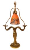 An early 20th century French gilt bronze table lamp by E. Lelievre, with pate de verre glass