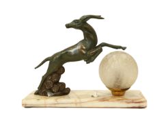 A French Art Deco bronzed spelter and marble table lamp modelled as an antelope, width 30cm,